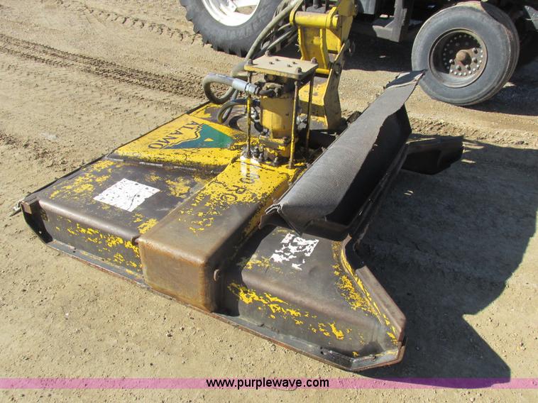 image for item L7087 1999 Ford New Holland TS110 tractor with side boom mower