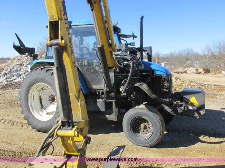 image for item L7087 1999 Ford New Holland TS110 tractor with side boom mower