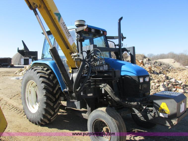 image for item L7087 1999 Ford New Holland TS110 tractor with side boom mower