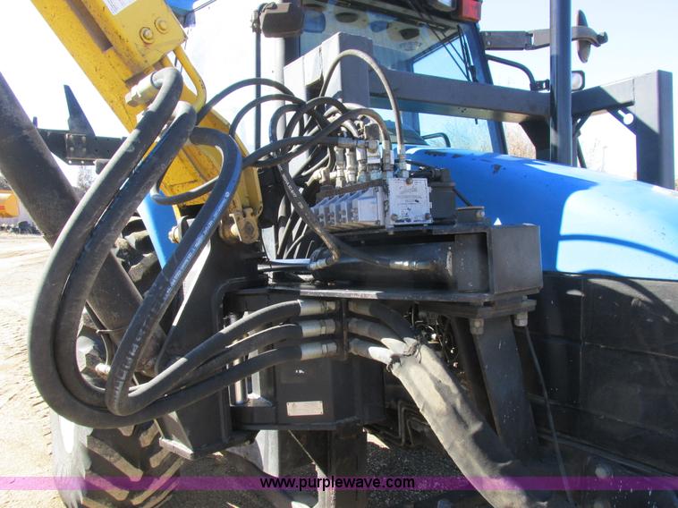 image for item L7087 1999 Ford New Holland TS110 tractor with side boom mower