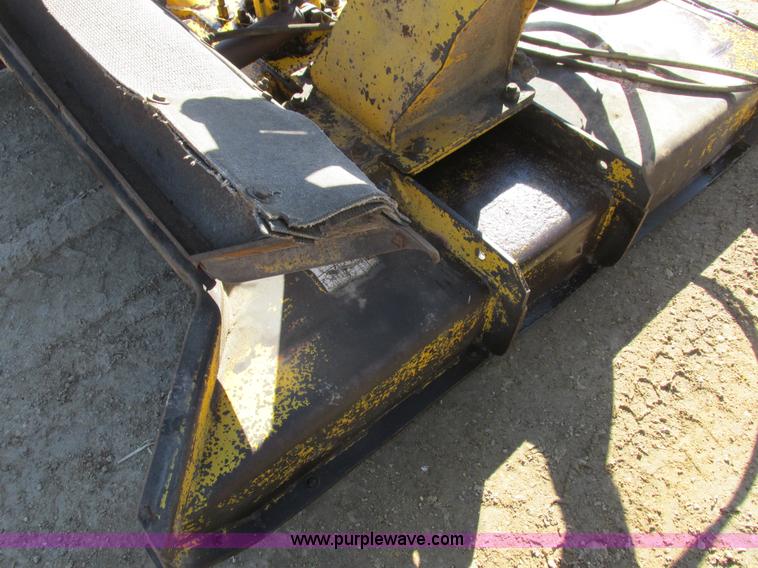 image for item L7087 1999 Ford New Holland TS110 tractor with side boom mower