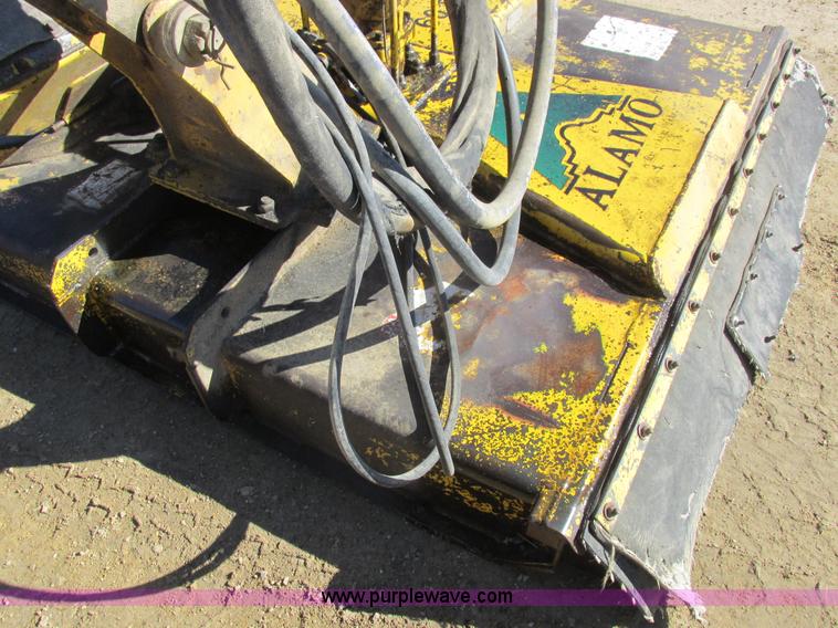 image for item L7087 1999 Ford New Holland TS110 tractor with side boom mower