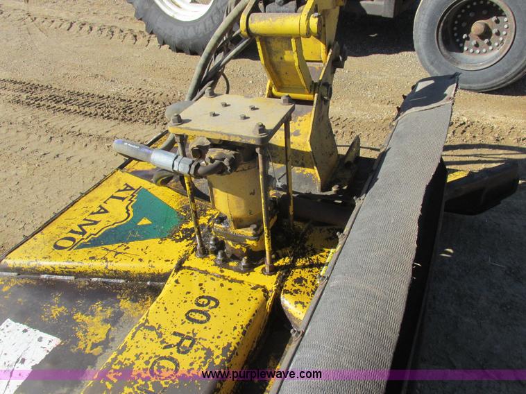 image for item L7087 1999 Ford New Holland TS110 tractor with side boom mower