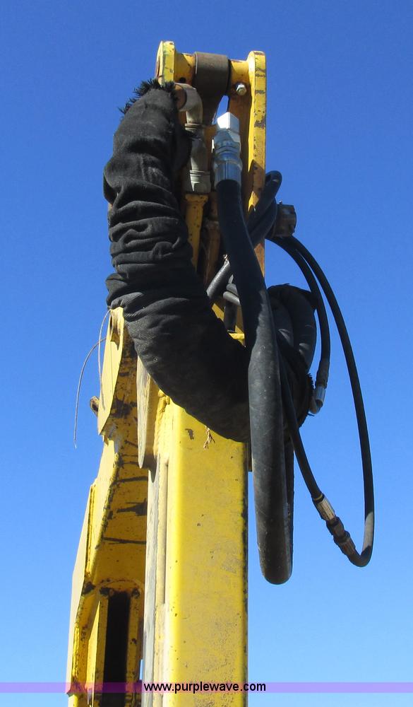 image for item L7087 1999 Ford New Holland TS110 tractor with side boom mower