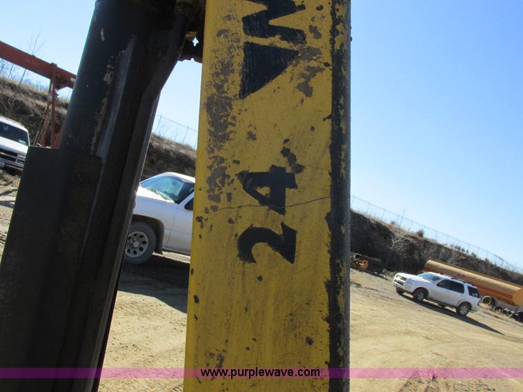 image for item L7087 1999 Ford New Holland TS110 tractor with side boom mower