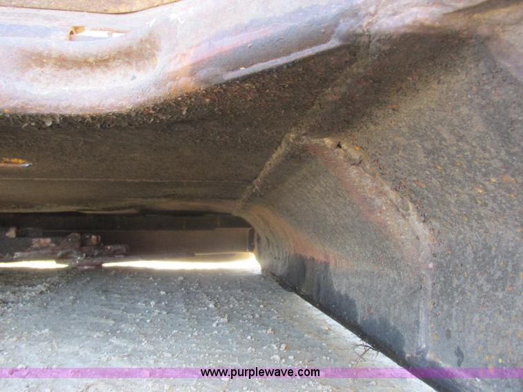 image for item L7087 1999 Ford New Holland TS110 tractor with side boom mower