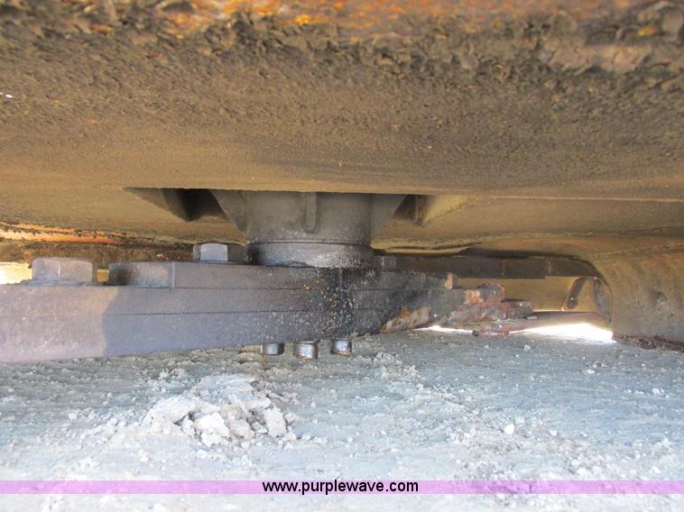 image for item L7087 1999 Ford New Holland TS110 tractor with side boom mower