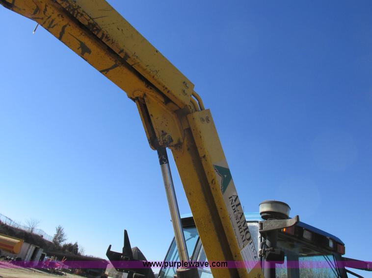 image for item L7087 1999 Ford New Holland TS110 tractor with side boom mower