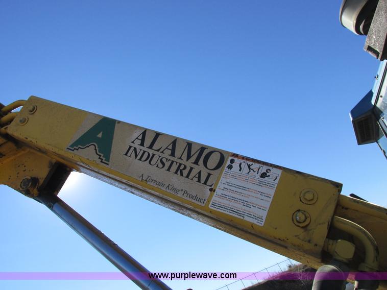 image for item L7087 1999 Ford New Holland TS110 tractor with side boom mower