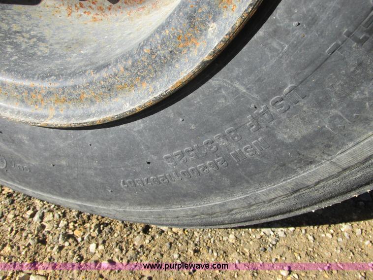 image for item L7087 1999 Ford New Holland TS110 tractor with side boom mower