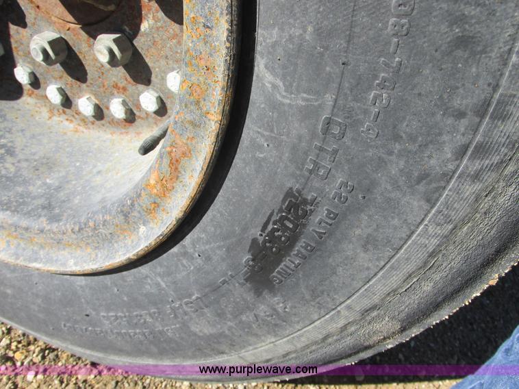 image for item L7087 1999 Ford New Holland TS110 tractor with side boom mower