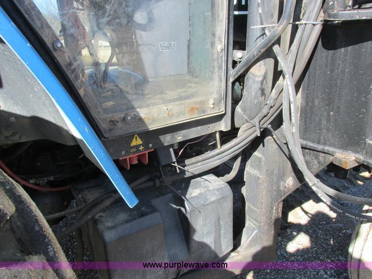 image for item L7087 1999 Ford New Holland TS110 tractor with side boom mower