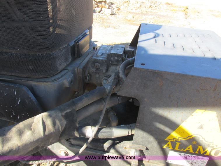 image for item L7087 1999 Ford New Holland TS110 tractor with side boom mower