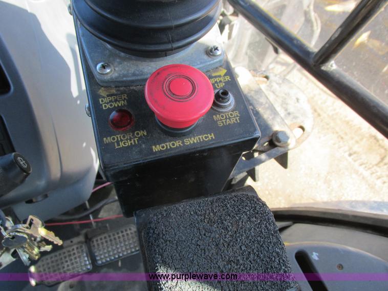 image for item L7087 1999 Ford New Holland TS110 tractor with side boom mower