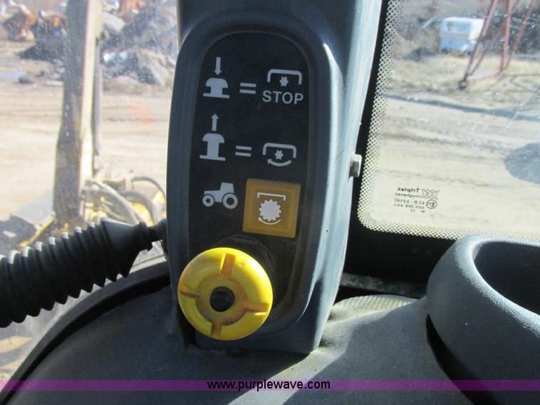 image for item L7087 1999 Ford New Holland TS110 tractor with side boom mower