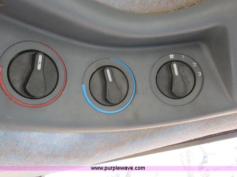 image for item L7087 1999 Ford New Holland TS110 tractor with side boom mower