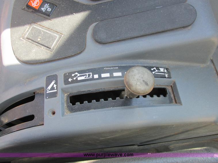 image for item L7087 1999 Ford New Holland TS110 tractor with side boom mower