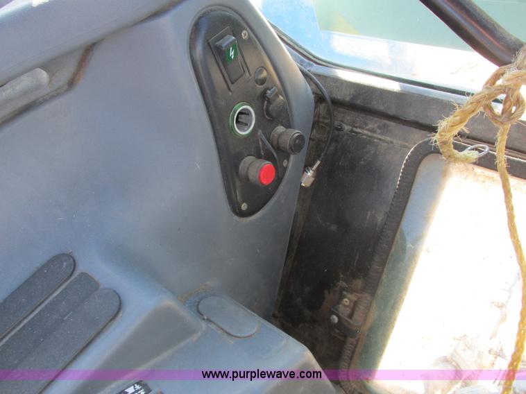 image for item L7087 1999 Ford New Holland TS110 tractor with side boom mower