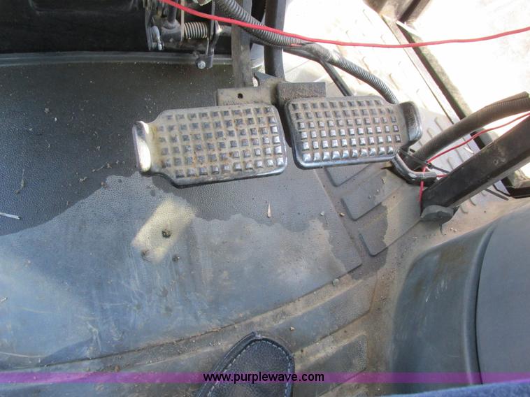 image for item L7087 1999 Ford New Holland TS110 tractor with side boom mower