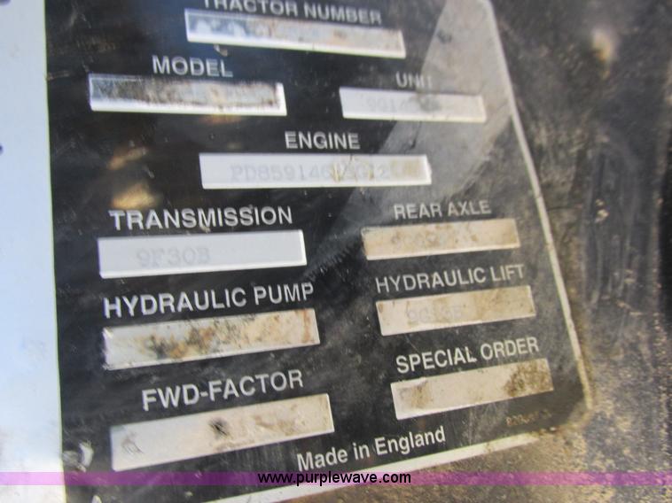 image for item L7087 1999 Ford New Holland TS110 tractor with side boom mower