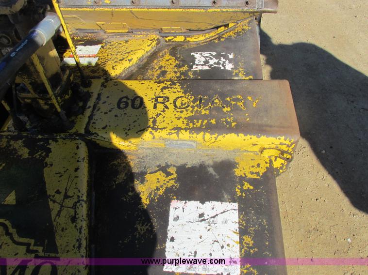 image for item L7087 1999 Ford New Holland TS110 tractor with side boom mower