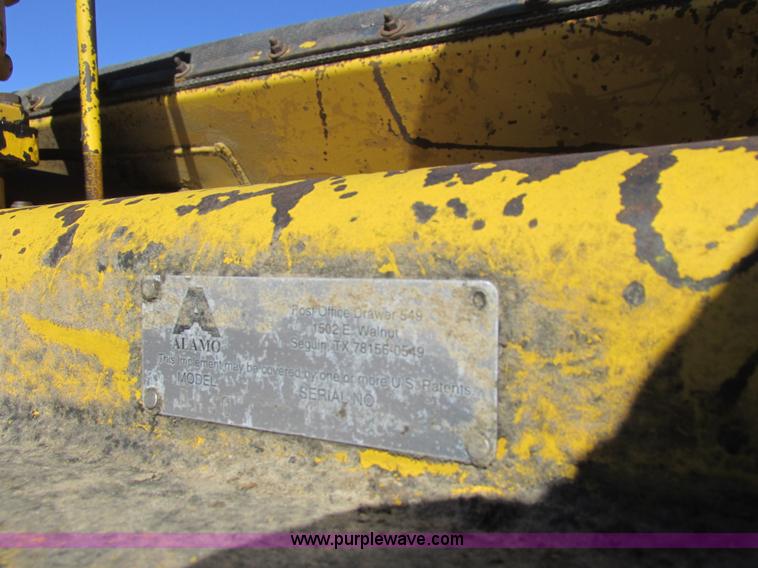 image for item L7087 1999 Ford New Holland TS110 tractor with side boom mower