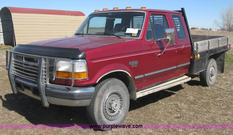 image for item J2882 1995 Ford F250 HD XLT SuperCab flatbed pickup truck