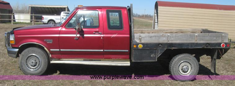 image for item J2882 1995 Ford F250 HD XLT SuperCab flatbed pickup truck