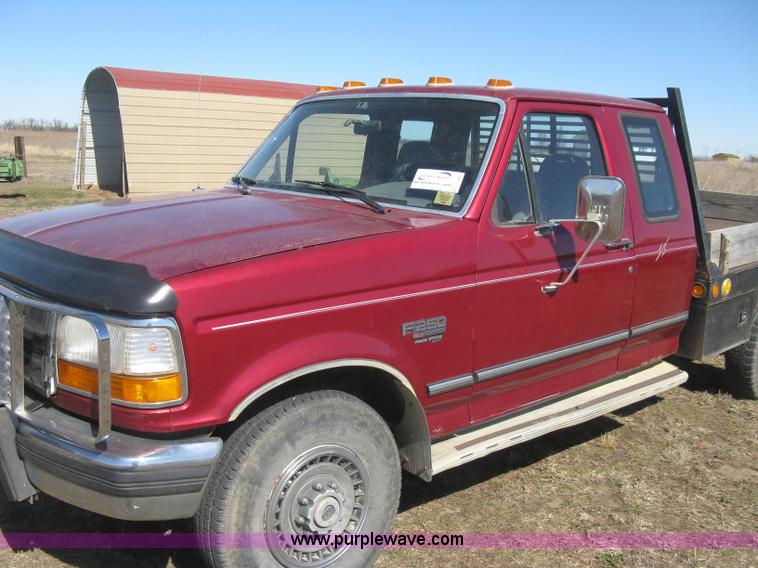 image for item J2882 1995 Ford F250 HD XLT SuperCab flatbed pickup truck