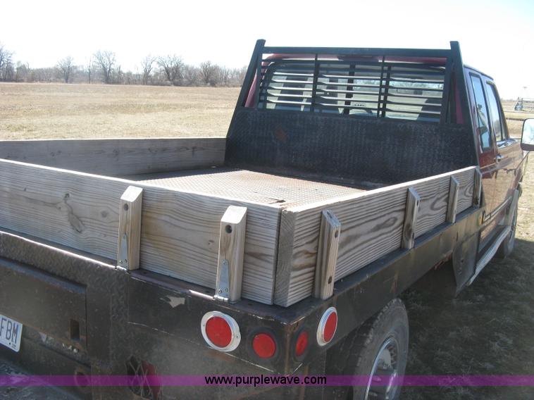 image for item J2882 1995 Ford F250 HD XLT SuperCab flatbed pickup truck