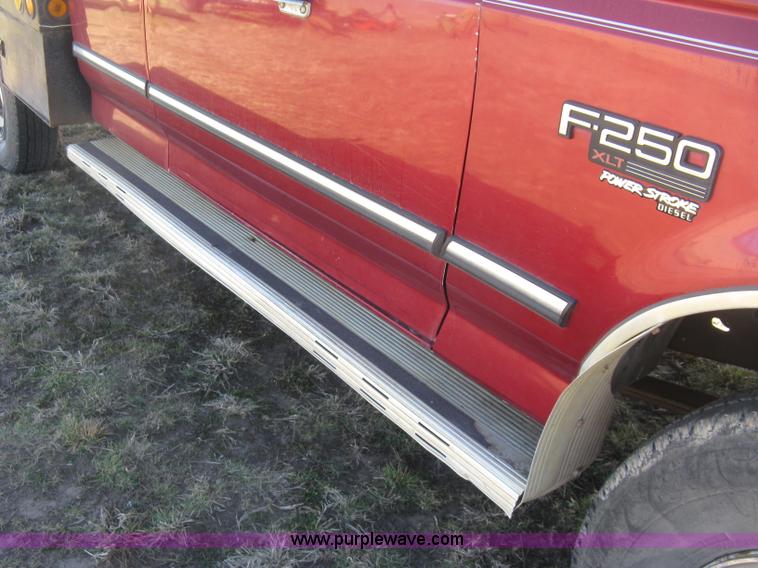 image for item J2882 1995 Ford F250 HD XLT SuperCab flatbed pickup truck