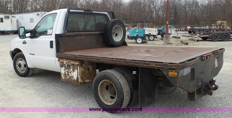 image for item K4266 1999 Ford F350 Super Duty XL flatbed pickup truck
