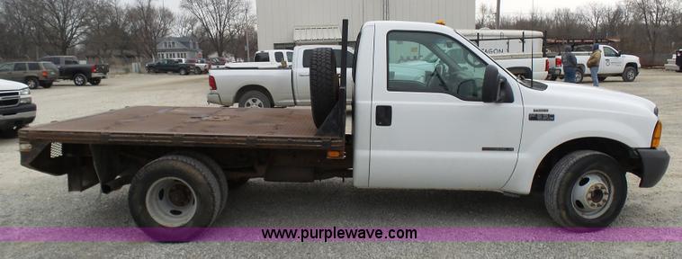 image for item K4266 1999 Ford F350 Super Duty XL flatbed pickup truck