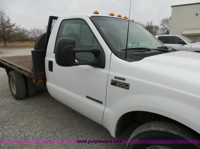 image for item K4266 1999 Ford F350 Super Duty XL flatbed pickup truck