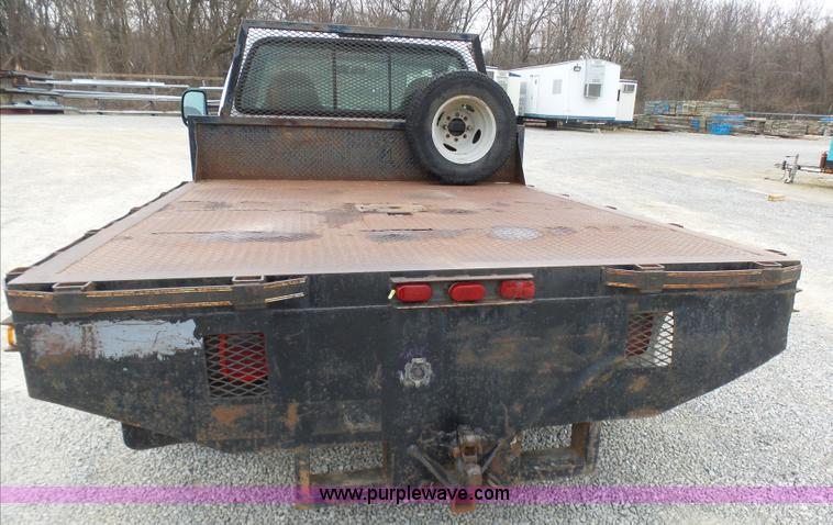 image for item K4266 1999 Ford F350 Super Duty XL flatbed pickup truck