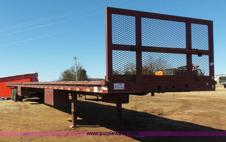 image for item K5779 2000 Big Tex 24-MF48 flatbed trailer