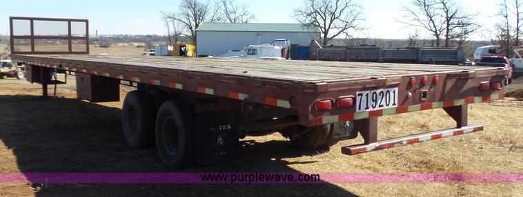 image for item K5779 2000 Big Tex 24-MF48 flatbed trailer