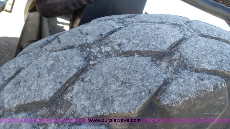 image for item BZ9069 2012 MacDon M205 self-propelled windrower