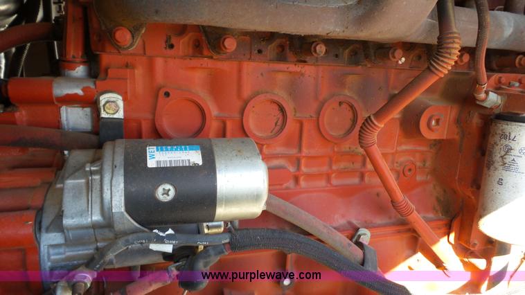 image for item BZ9069 2012 MacDon M205 self-propelled windrower