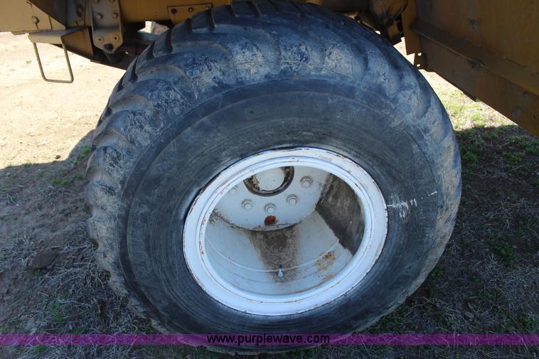 image for item J7559 Ag-Chem TerraGator 1664 self-propelled dry spreader applicator