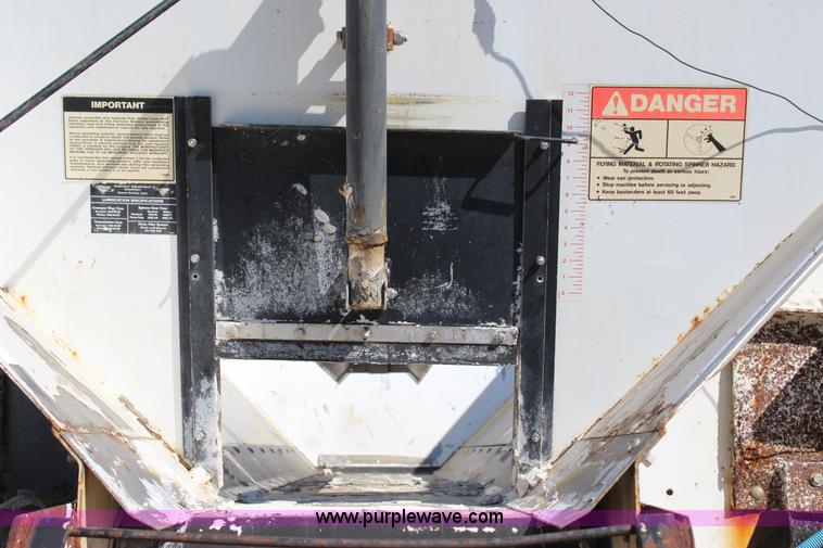 image for item J7559 Ag-Chem TerraGator 1664 self-propelled dry spreader applicator