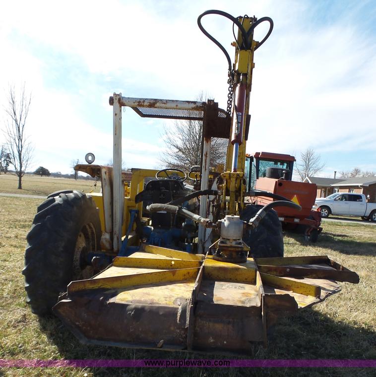 image for item L6250 Ford 5600 tractor with side boom mower