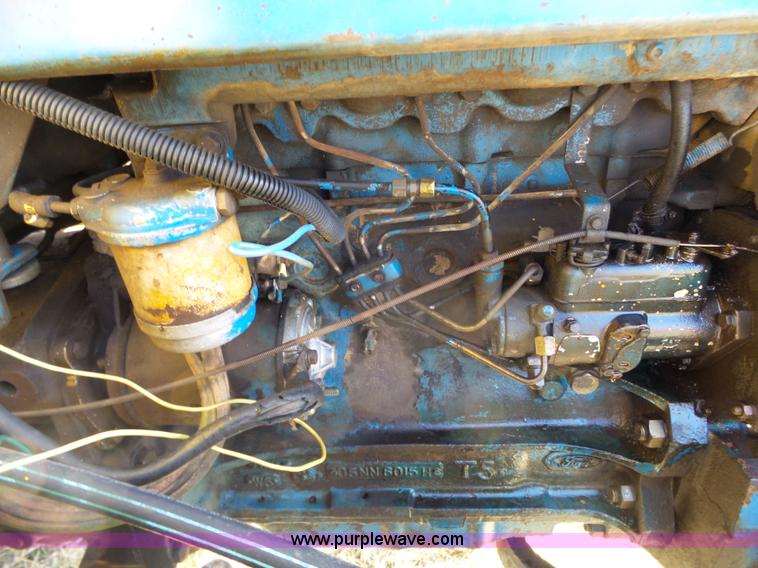image for item L6250 Ford 5600 tractor with side boom mower