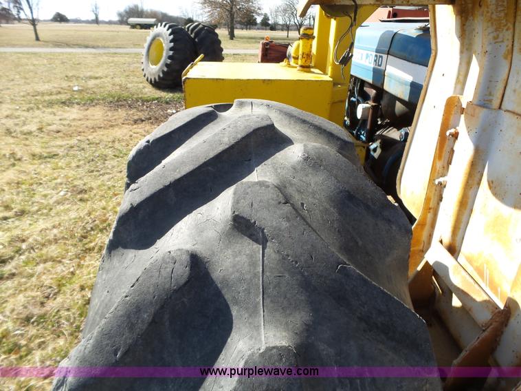 image for item L6250 Ford 5600 tractor with side boom mower