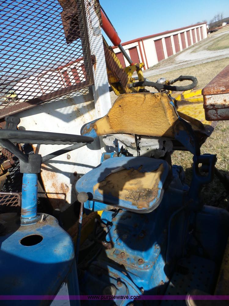 image for item L6250 Ford 5600 tractor with side boom mower