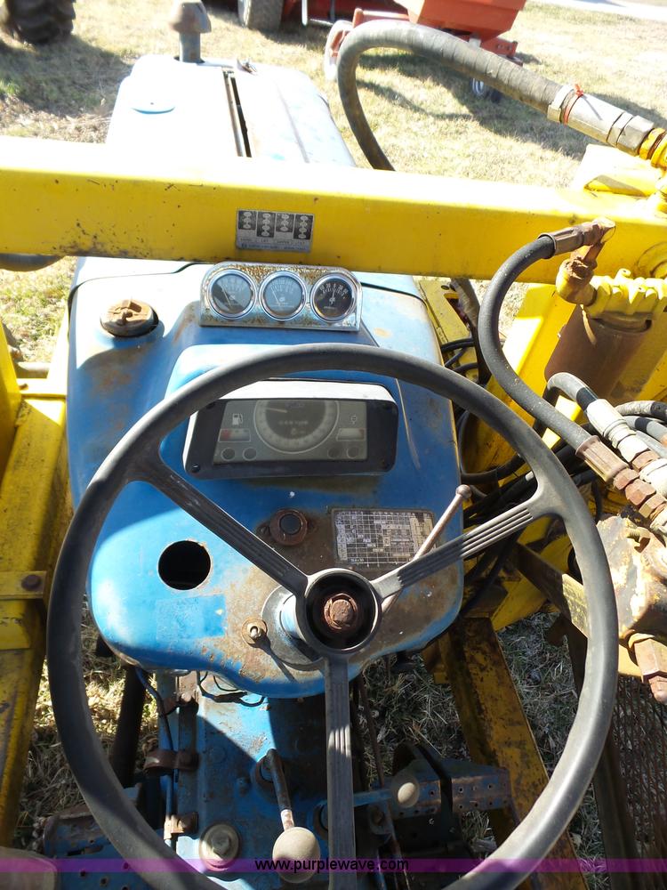 image for item L6250 Ford 5600 tractor with side boom mower