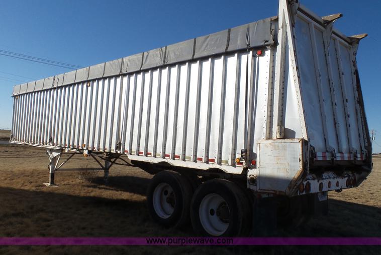 image for item L6499 2002 Imco T107 chain/slat bottom silage trailer