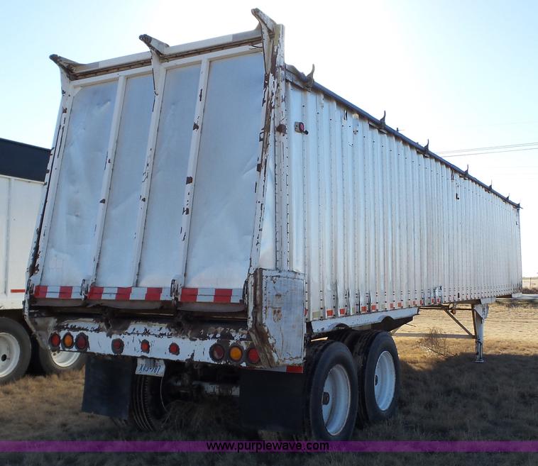 image for item L6499 2002 Imco T107 chain/slat bottom silage trailer