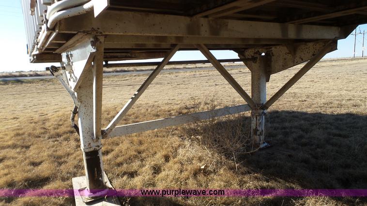 image for item L6499 2002 Imco T107 chain/slat bottom silage trailer