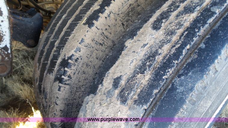 image for item L6499 2002 Imco T107 chain/slat bottom silage trailer